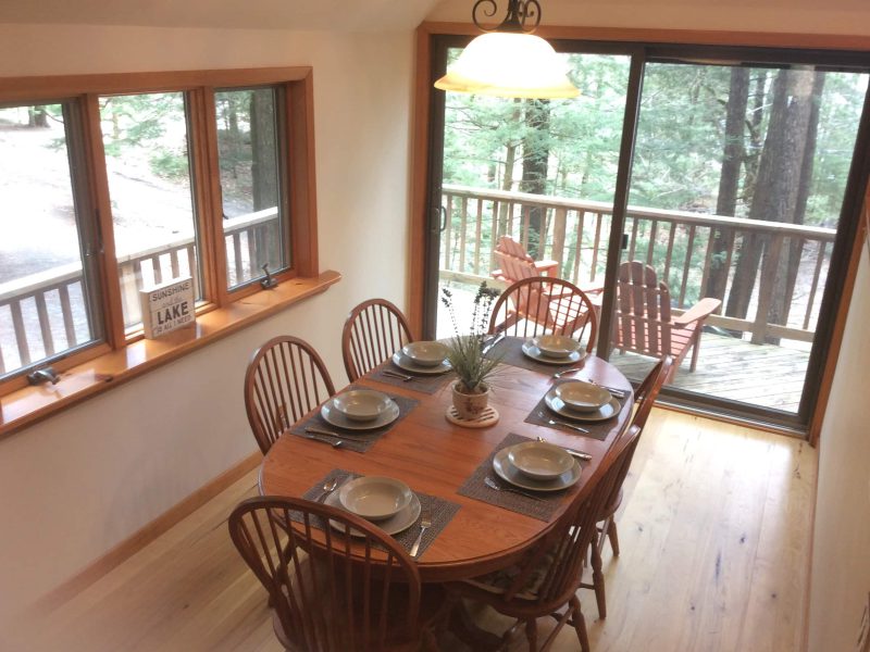 Dining table beside the deck windows