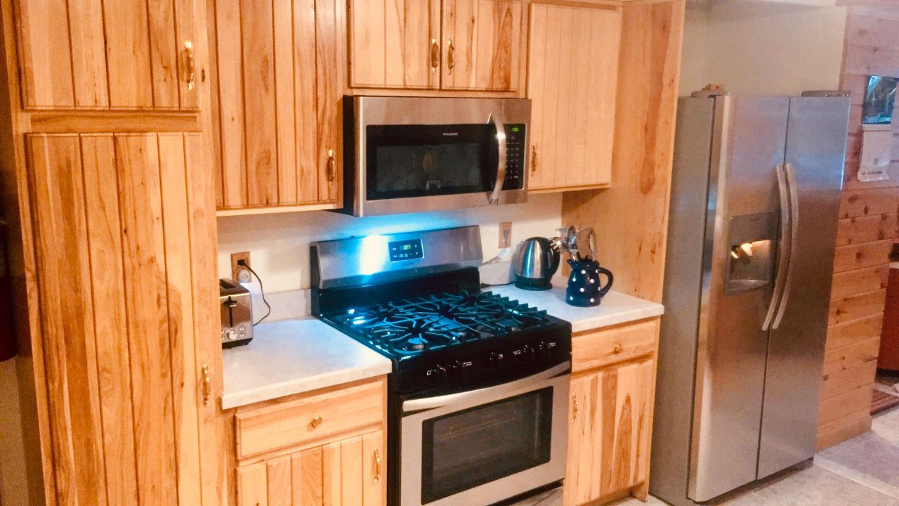 Kitchen with a gas range and stainless steel appliances