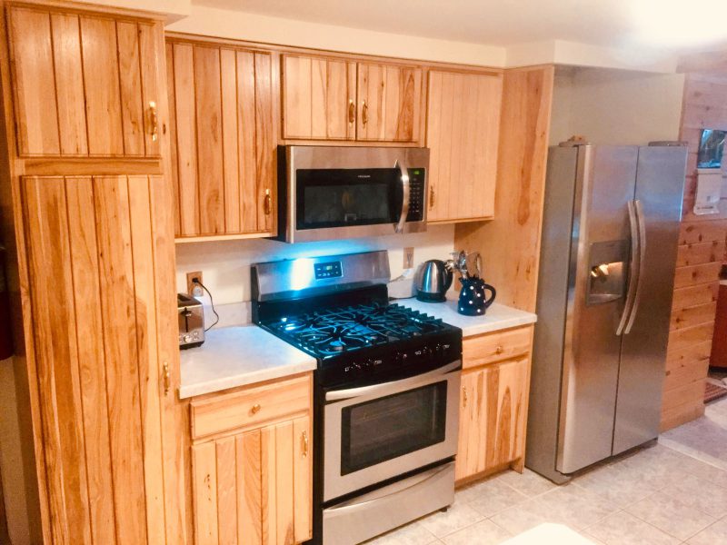 Kitchen with a gas range and stainless steel appliances